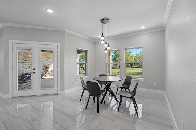 dining area featuring french doors and crown molding