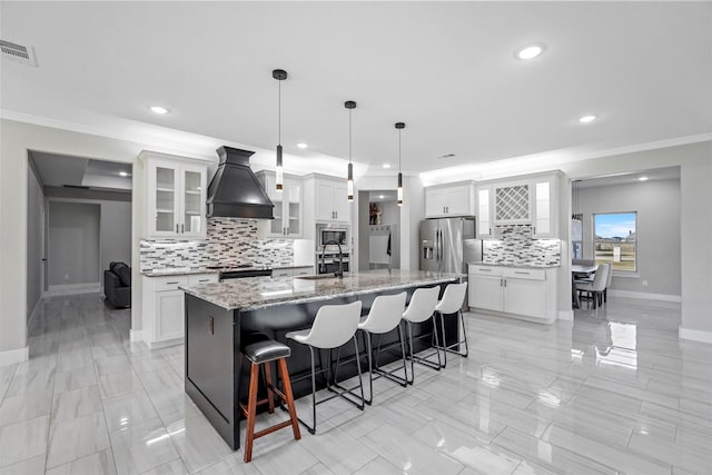 1055 Encino Ct, Wills Point, TX 75169 - kitchen with custom exhaust hood, appliances with stainless steel finishes, a sink, backsplash, and crown molding