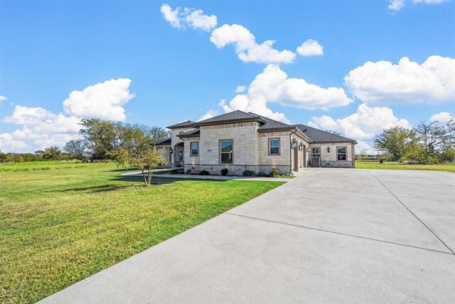 1055 Encino Ct, Wills Point, TX 75169 - view of front of property featuring stone siding, a garage, concrete driveway, and a front lawn