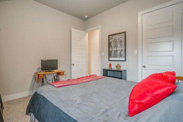 bedroom with light hardwood / wood-style flooring, ceiling fan, and vaulted ceiling