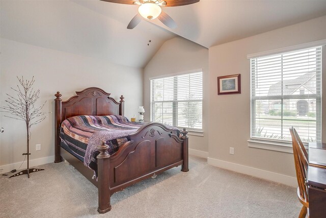 bedroom featuring light wood-type flooring, multiple windows, lofted ceiling, ceiling fan, and ensuite bathroom