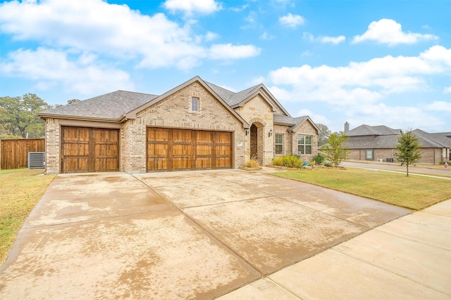 view of front facade featuring a garage and a front lawn