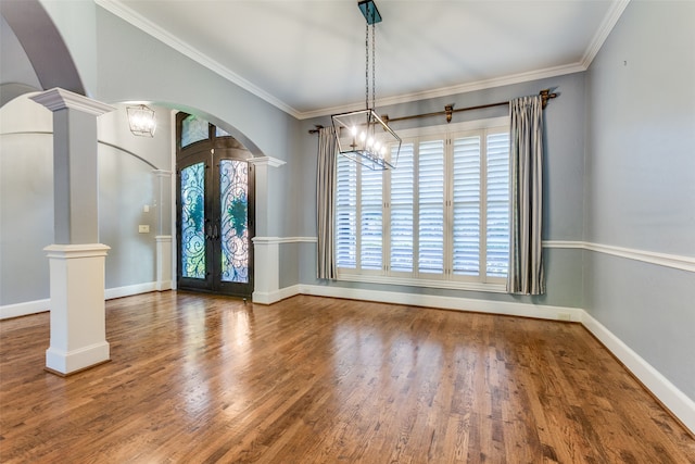 unfurnished dining area with ornate columns and ornamental molding