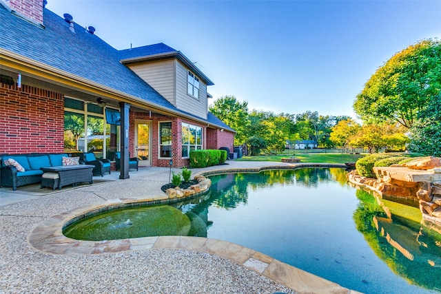 view of pool with an outdoor hangout area, a patio, and ceiling fan