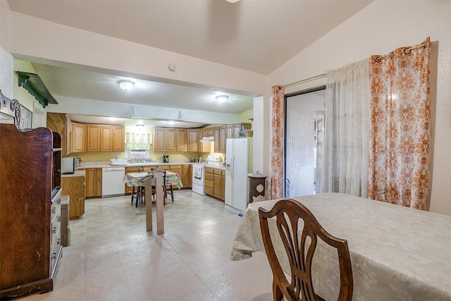 dining room featuring a wealth of natural light and lofted ceiling