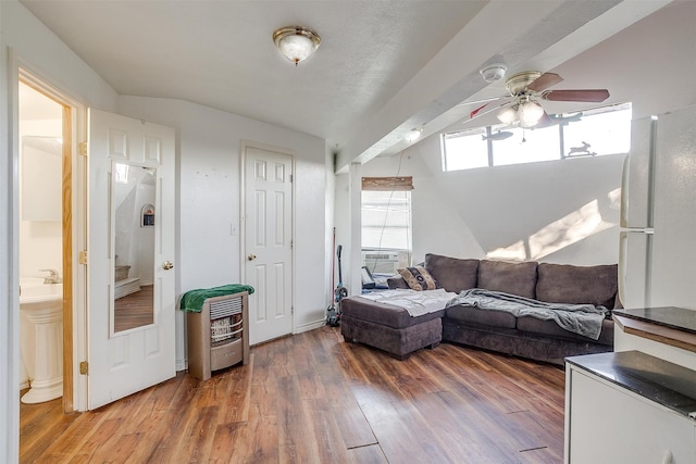 living room with cooling unit, hardwood / wood-style floors, and ceiling fan