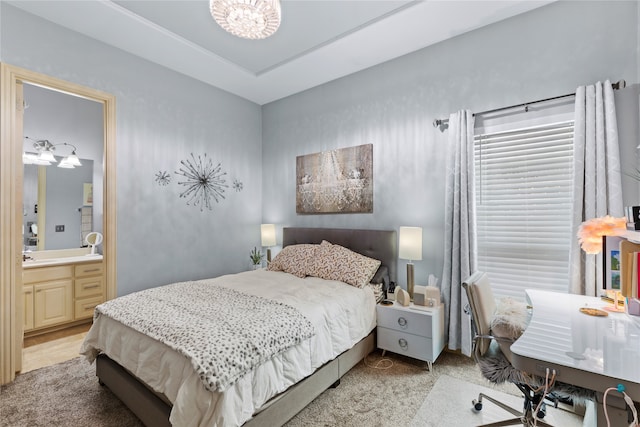 carpeted bedroom with ensuite bath