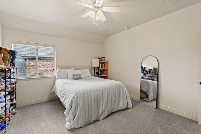 carpeted bedroom featuring lofted ceiling and ceiling fan