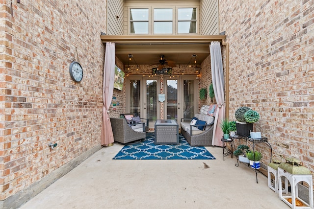 doorway to property with ceiling fan, a patio, and an outdoor hangout area