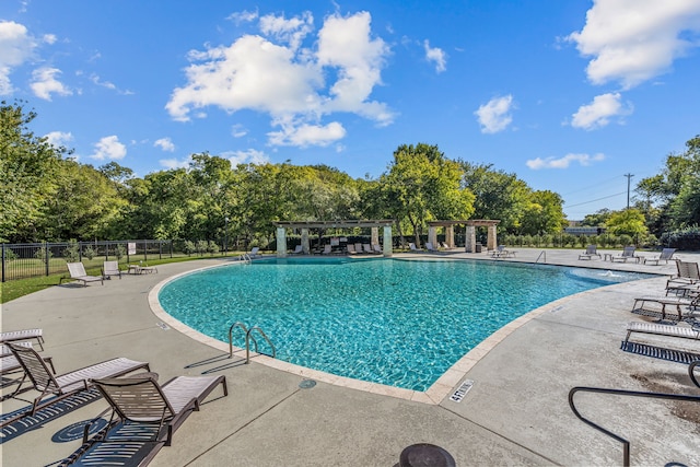 view of swimming pool with a patio area