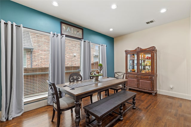 dining space featuring dark hardwood / wood-style floors