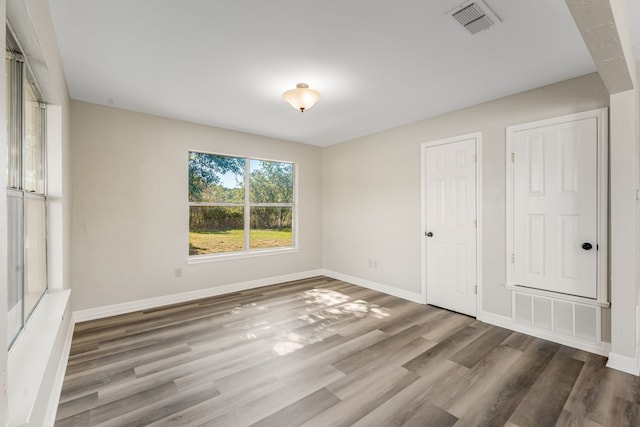 unfurnished bedroom featuring wood-type flooring