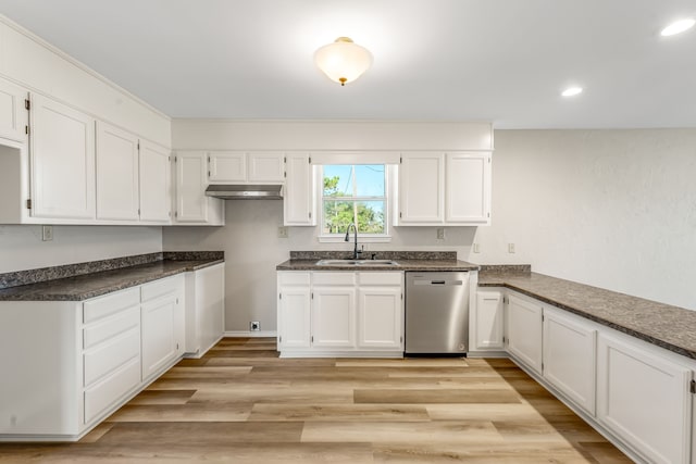 kitchen with stainless steel dishwasher, white cabinetry, sink, and light hardwood / wood-style flooring