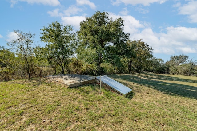 entry to storm shelter with a lawn