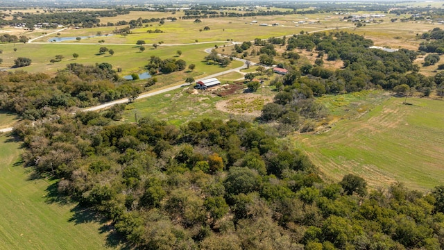 birds eye view of property with a rural view and a water view