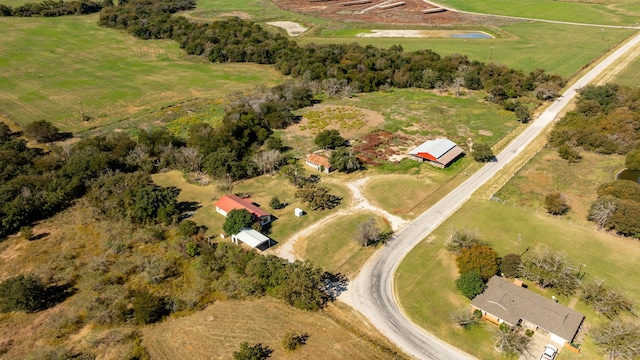 birds eye view of property featuring a rural view