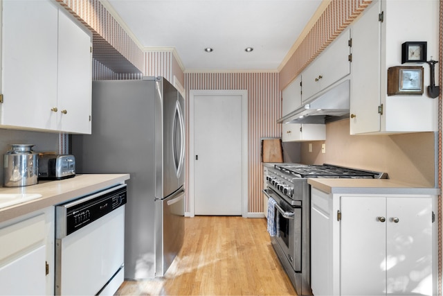 kitchen featuring white cabinetry, light wood-type flooring, high end stove, and dishwasher