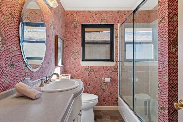 full bathroom with crown molding, vanity, combined bath / shower with glass door, and toilet