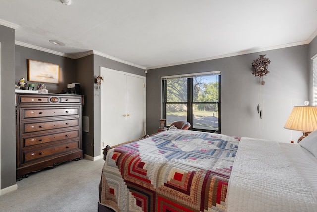 bedroom with light carpet, crown molding, and a closet