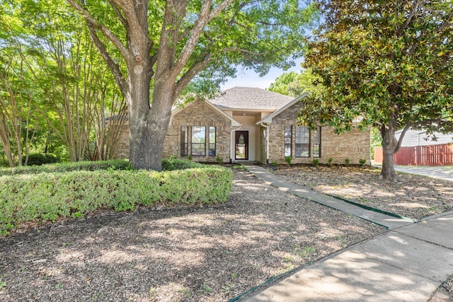 1901 Shady Hollow Ct, Garland, TX 75040 - view of front of home featuring brick siding and roof with shingles