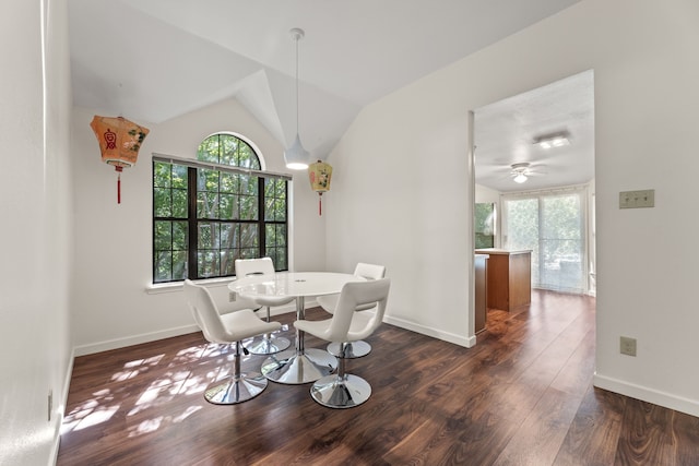 dining room featuring lofted ceiling, a healthy amount of sunlight, ceiling fan, and dark wood-type flooring