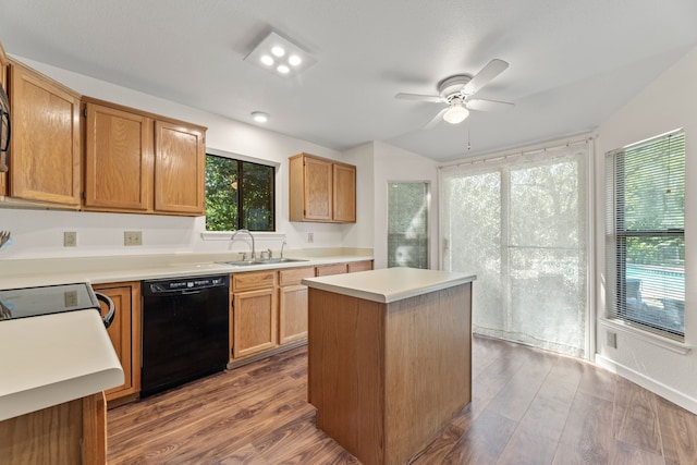 1901 Shady Hollow Ct, Garland, TX 75040 - kitchen with black dishwasher, a sink, a ceiling fan, light countertops, and dark wood-style floors