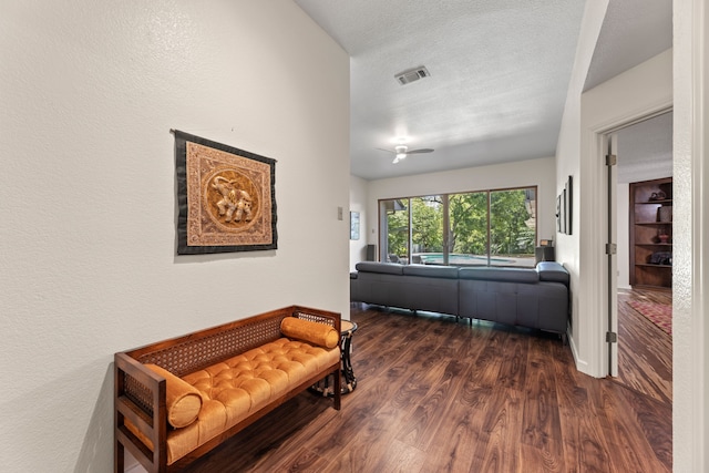 hall featuring dark hardwood / wood-style flooring and a textured ceiling