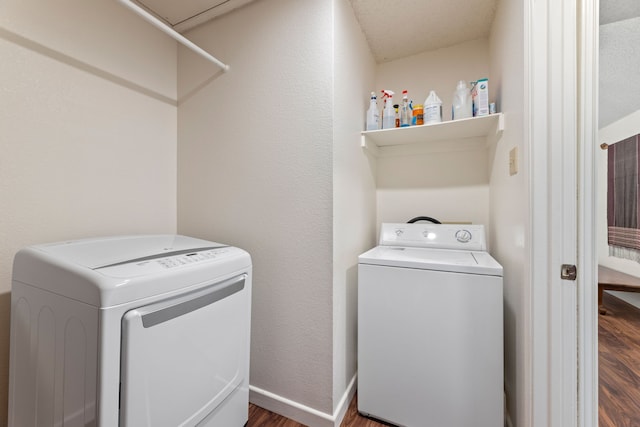 1901 Shady Hollow Ct, Garland, TX 75040 - laundry room with washing machine and dryer, dark wood-type flooring, and baseboards