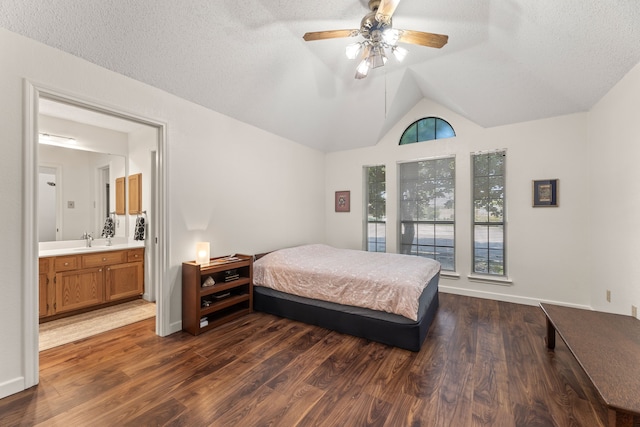1901 Shady Hollow Ct, Garland, TX 75040 - bedroom featuring a sink, dark wood-style floors, lofted ceiling, ensuite bath, and ceiling fan