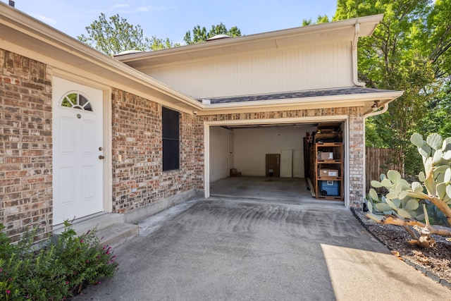 view of exterior entry featuring a garage