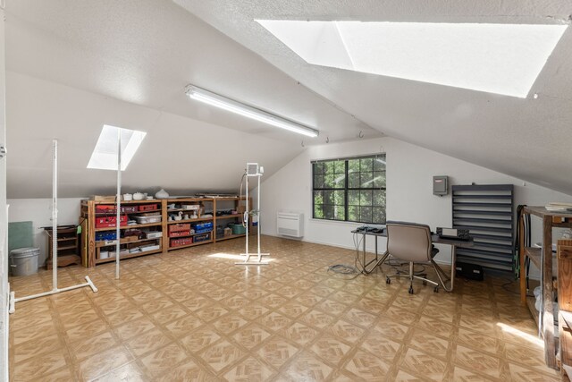 1901 Shady Hollow Ct, Garland, TX 75040 - office area with a skylight, vaulted ceiling, and light floors