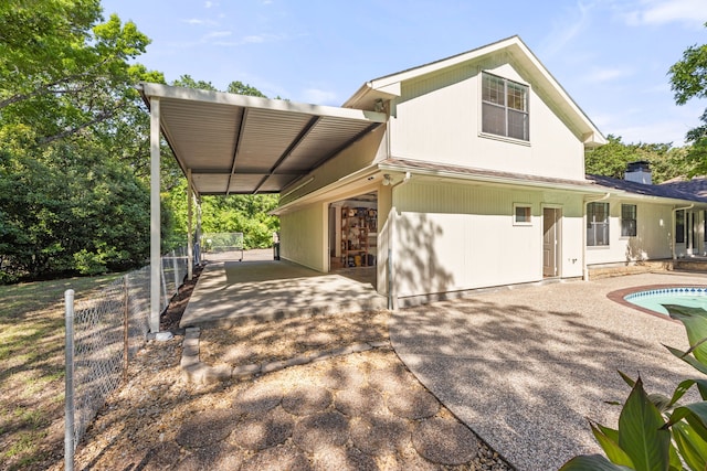 back of property with a patio