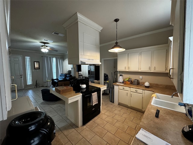 kitchen featuring hanging light fixtures, sink, ceiling fan, electric range, and white cabinetry