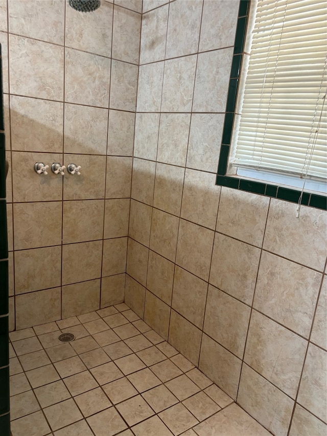 bathroom with tiled shower