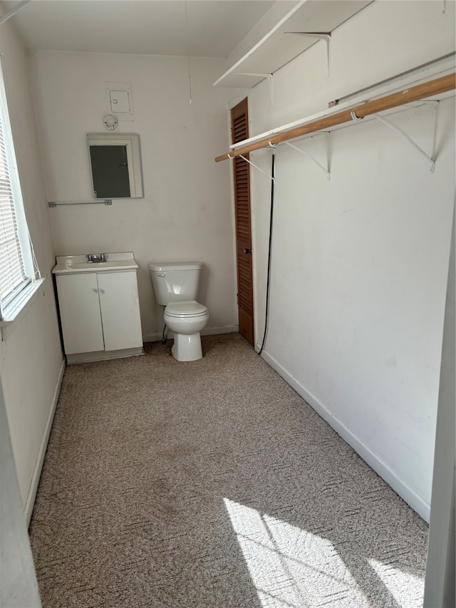 bathroom featuring toilet and vanity