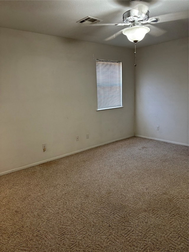 unfurnished room with carpet flooring and ceiling fan