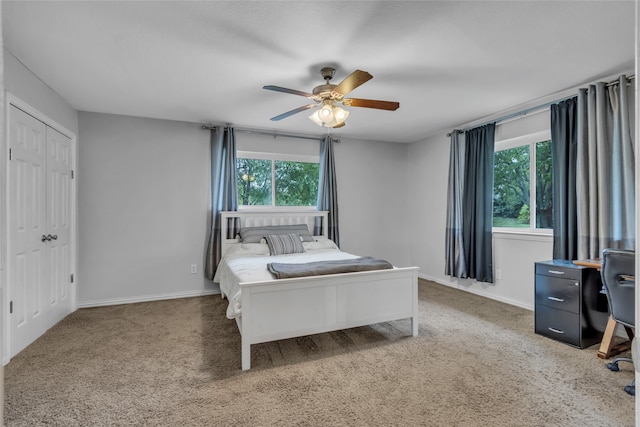 carpeted bedroom featuring ceiling fan