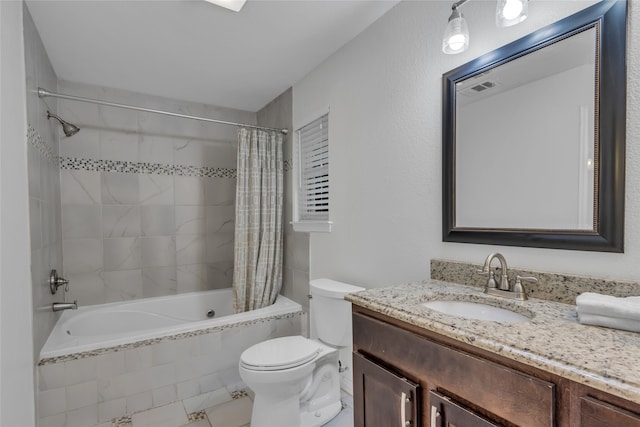 bathroom featuring tiled shower / bath combo, visible vents, toilet, and vanity