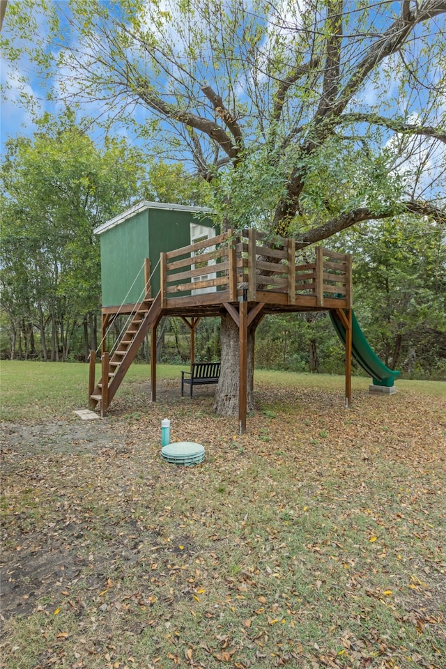 view of jungle gym with stairway and a wooden deck