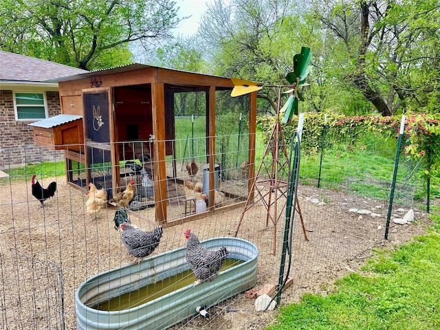 view of jungle gym featuring an outbuilding and exterior structure