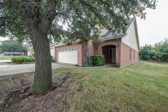 ranch-style home with a garage and a front lawn