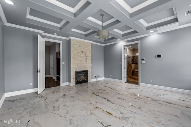 unfurnished living room featuring beam ceiling, a large fireplace, crown molding, and coffered ceiling