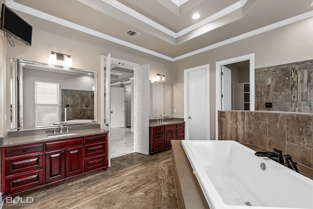 bathroom featuring tile walls, vanity, wood-type flooring, and crown molding