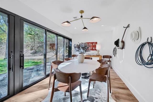 dining area with light hardwood / wood-style flooring