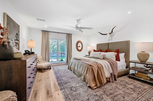 bedroom featuring ceiling fan and light hardwood / wood-style floors