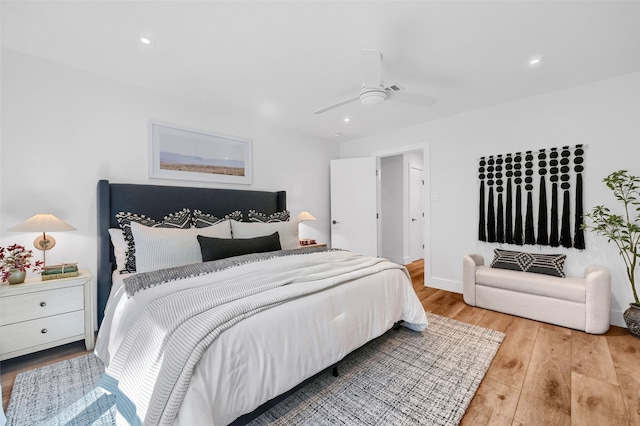 bedroom featuring ceiling fan and light hardwood / wood-style flooring