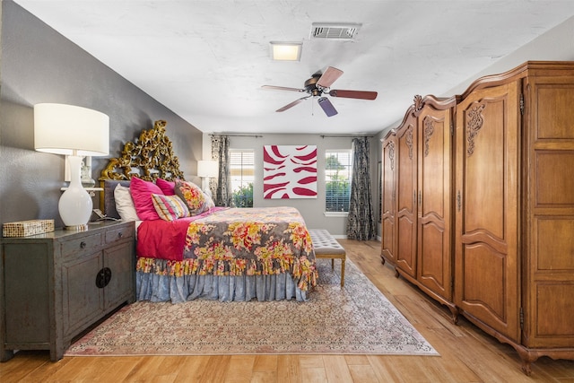 bedroom featuring light wood-type flooring and ceiling fan