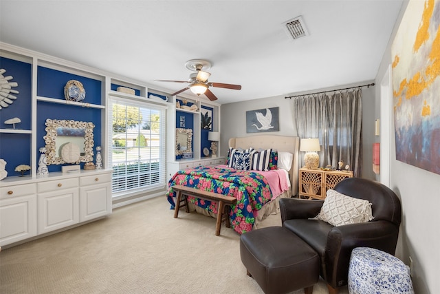 bedroom featuring light carpet and ceiling fan