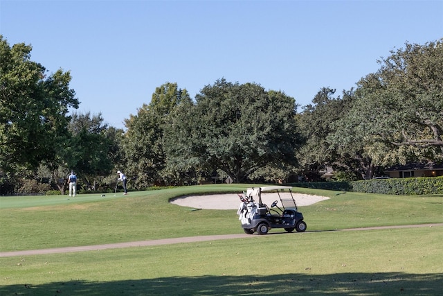 7117 Serrano Dr, Benbrook, TX 76126 - view of property's community with a lawn and view of wooded area