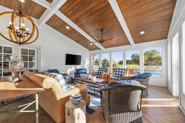 sunroom / solarium featuring lofted ceiling with beams, ceiling fan with notable chandelier, and wood ceiling